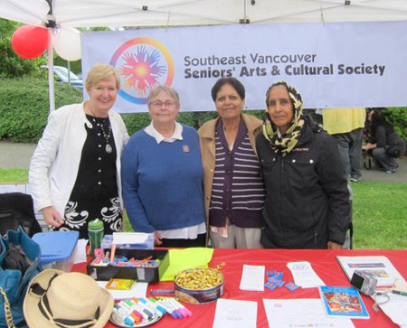 Champlain Summer Fair, June 2013. B.C. Minister of Justice Suzanne Anton visits with Southeast Vancouver Seniors Arts and Cultural Centre members who are soliciting donations and providing information to seniors.